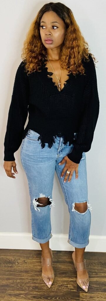Reel cover: Lovett Love in a black sweater and ripped jeans